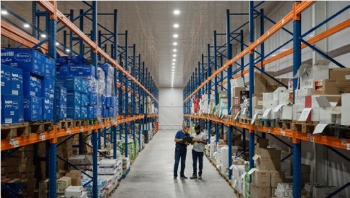 Distribution team reviewing inventory in the warehouse