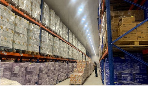 Warehouse aisle with high-bay racking and palletized inventory